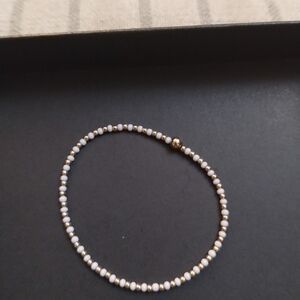 Erica Woolston White And Gold Bead Bracelet